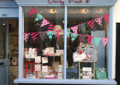 Bunting shop window graphics for a summery window display
