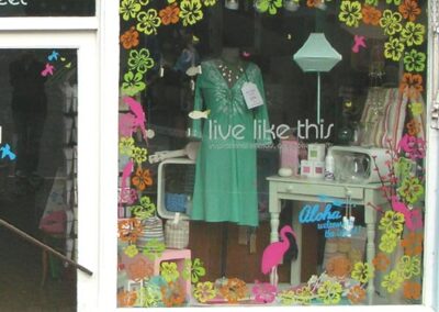 Hibiscus flower shop window graphic kit framing a summer window display